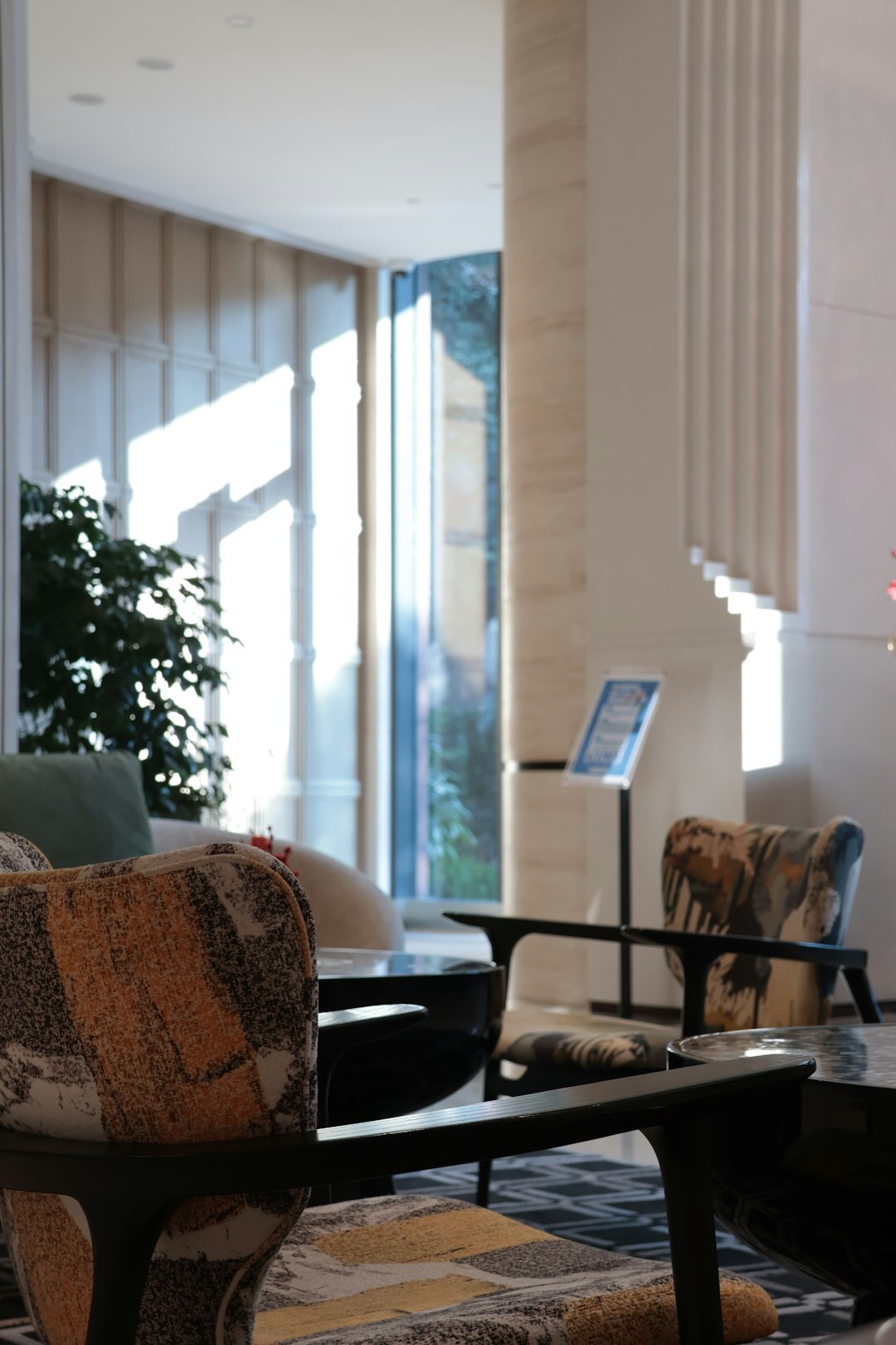 Bright modern office reception area with seating and plants