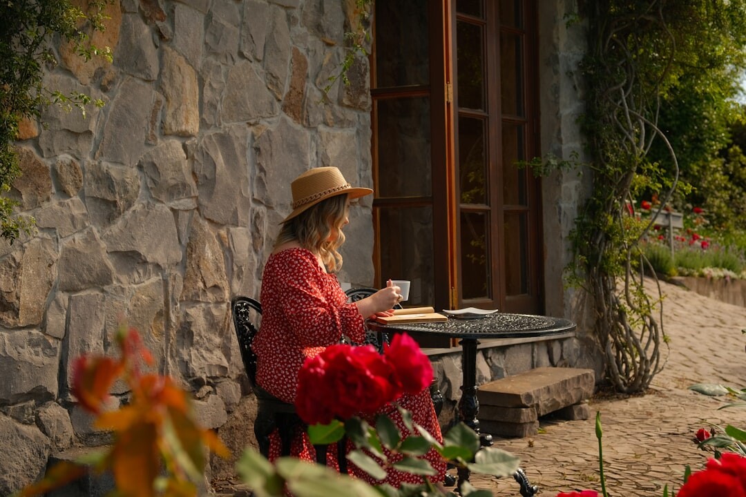 elderly man reading book in garden